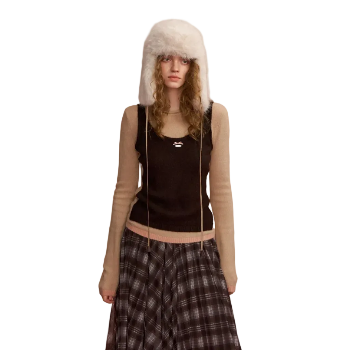 Color-blocked Vest Layered Over A Long-sleeved Sweater In Brown