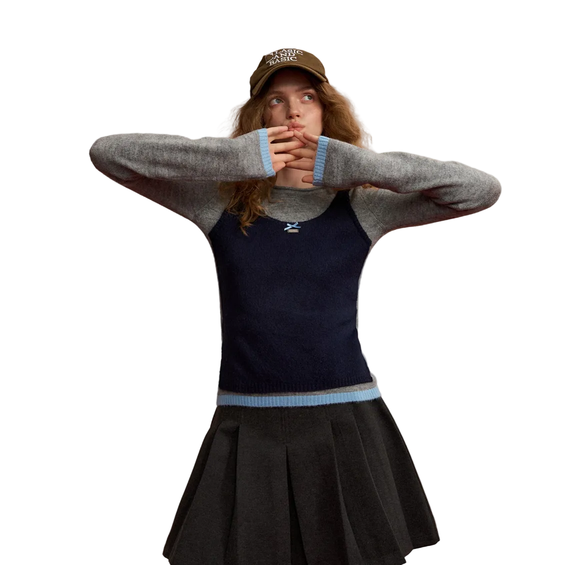 Color-blocked Vest Layered Over A Long-sleeved Sweater In Gray