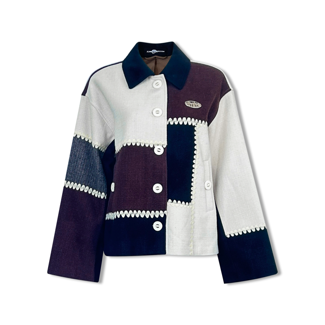 スプライスギアトリムとシルバーラベルが付いた黒と白のジャケット