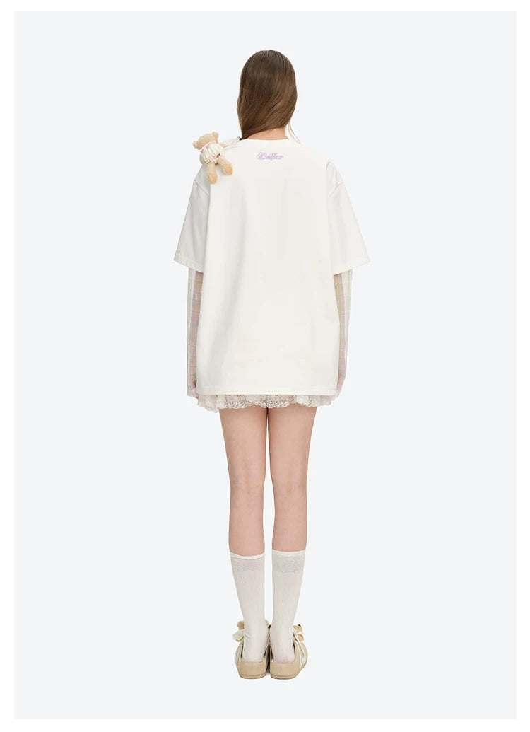 ホワイトの花柄フェイクツーピース長袖Tシャツ