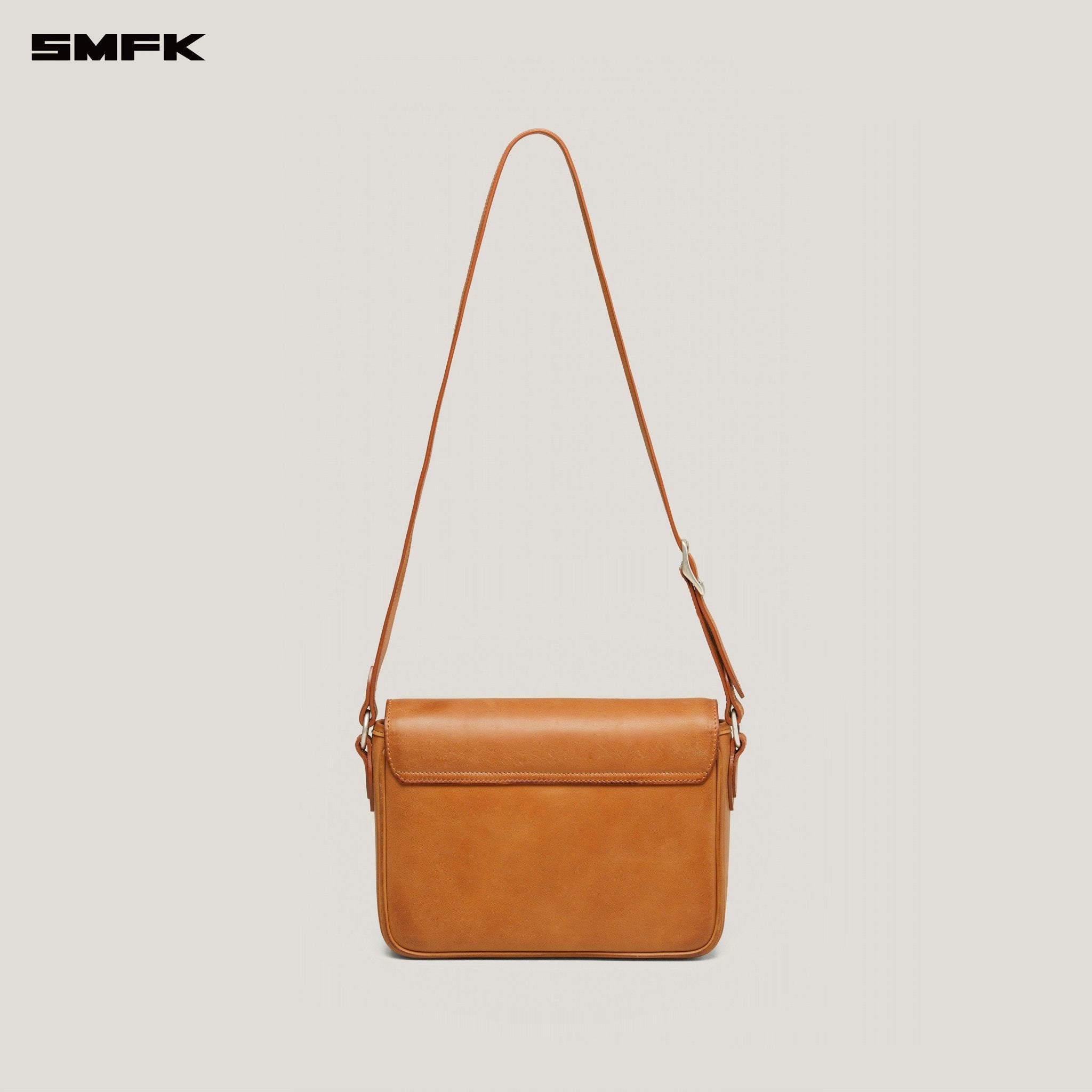 SMFK Compass Badge Patina Leather Flip Bag In Caramel (Medium) | MADAX