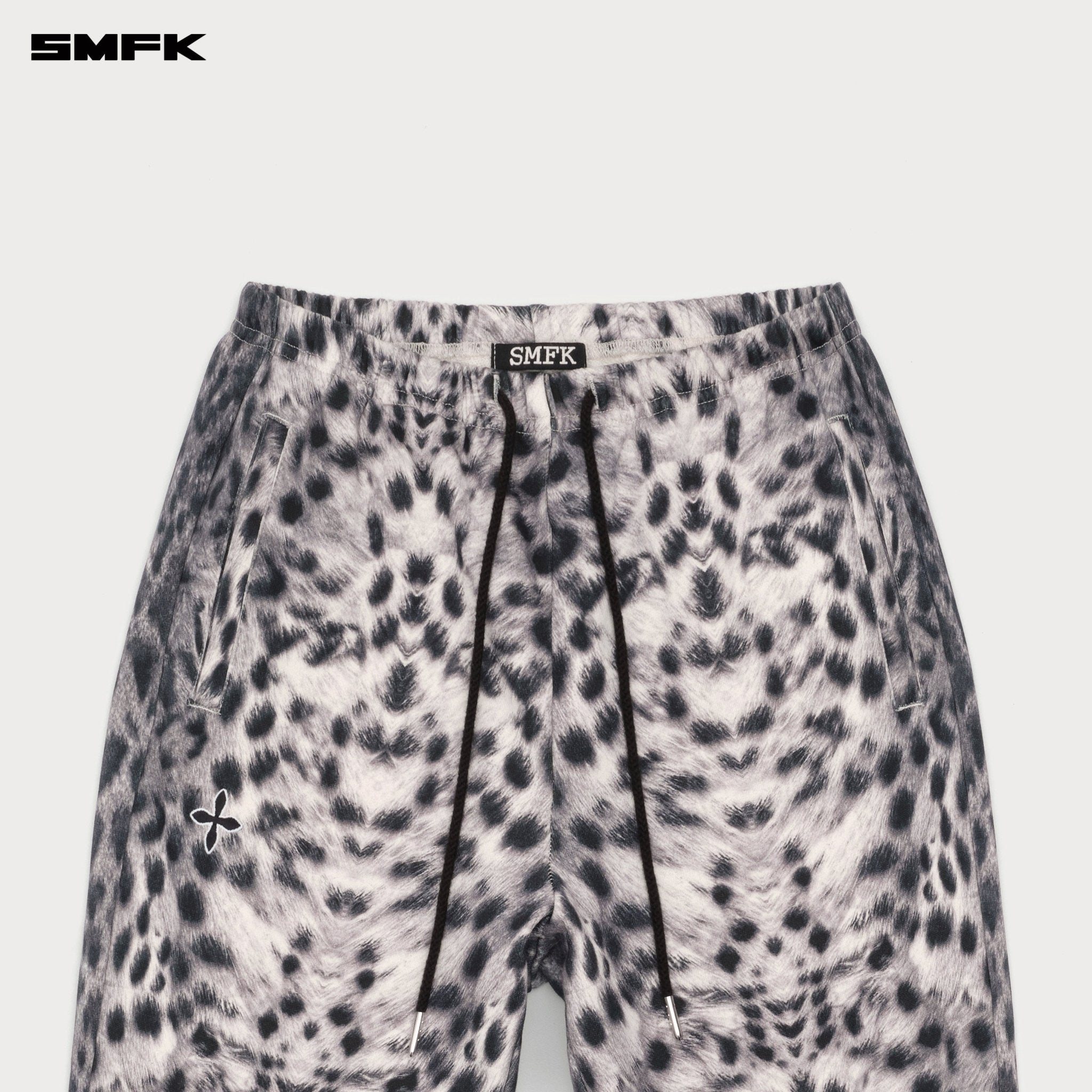 SMFK Compass Cross Classic Flared Sweatpants In White Leopard | MADAX