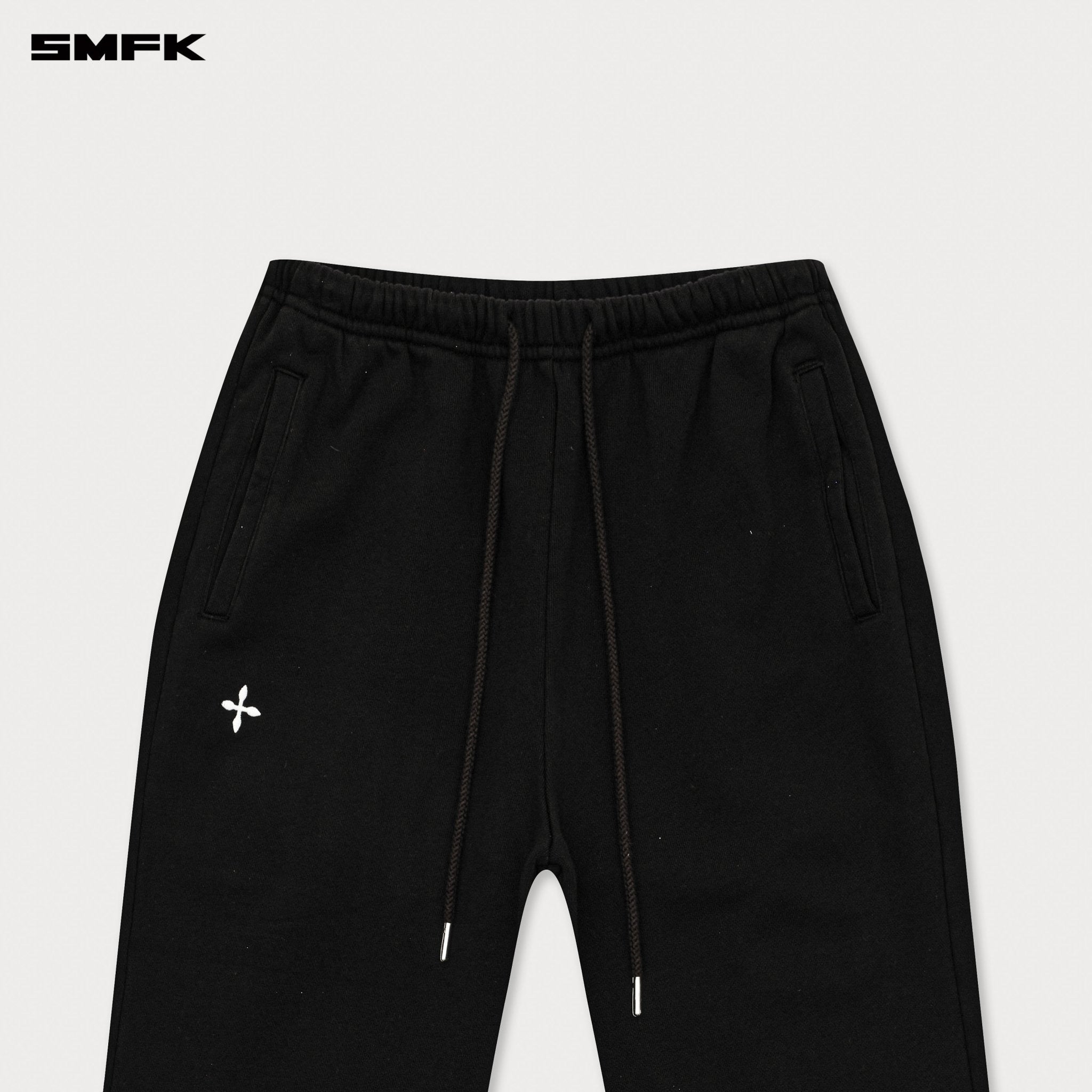 SMFK Compass Cross Classic Flared Track Pants In Black | MADAX