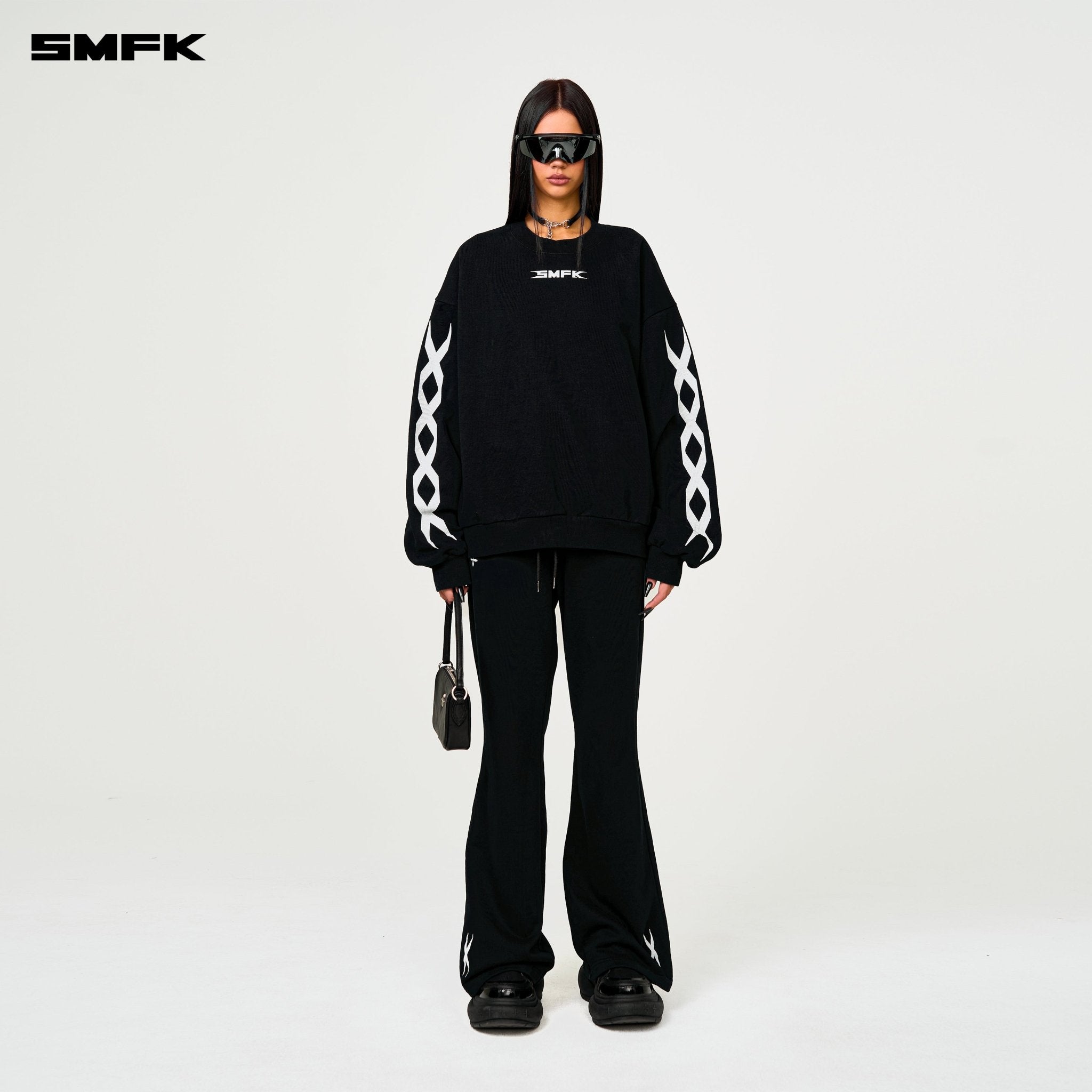SMFK Compass Cross Classic Flared Track Pants In Black | MADAX