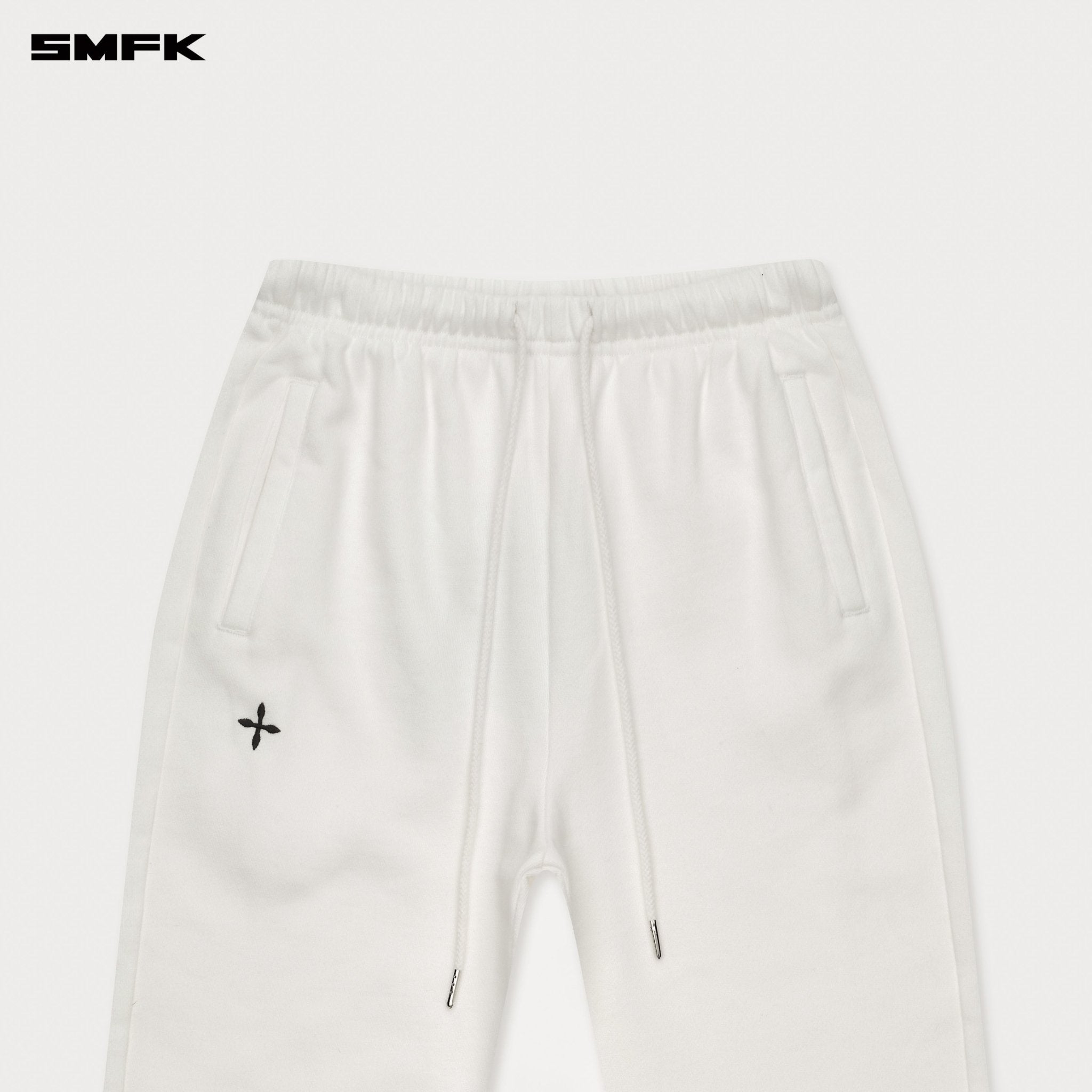 SMFK Compass Cross Classic Flared Track Pants In White | MADAX