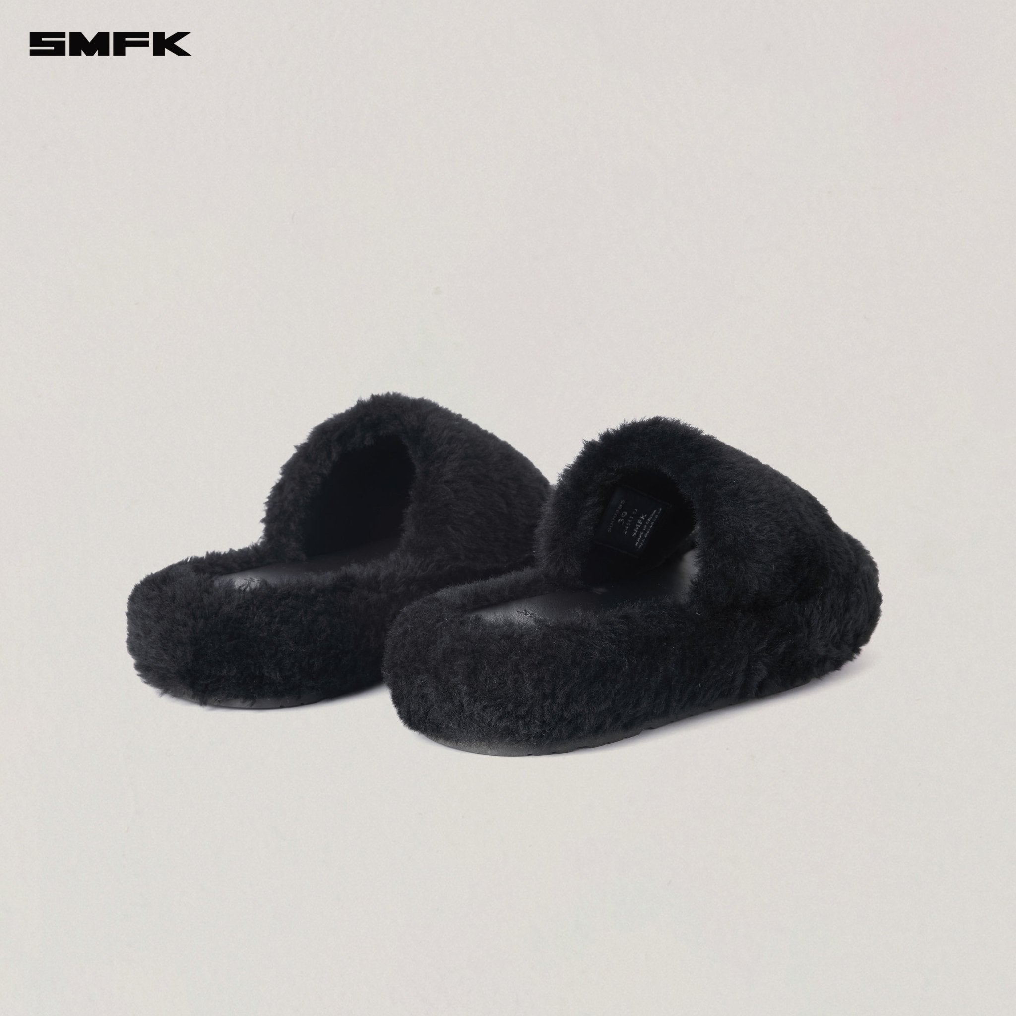 SMFK Compass Mode Unity Shearling Slipper in Wild Black | MADAX
