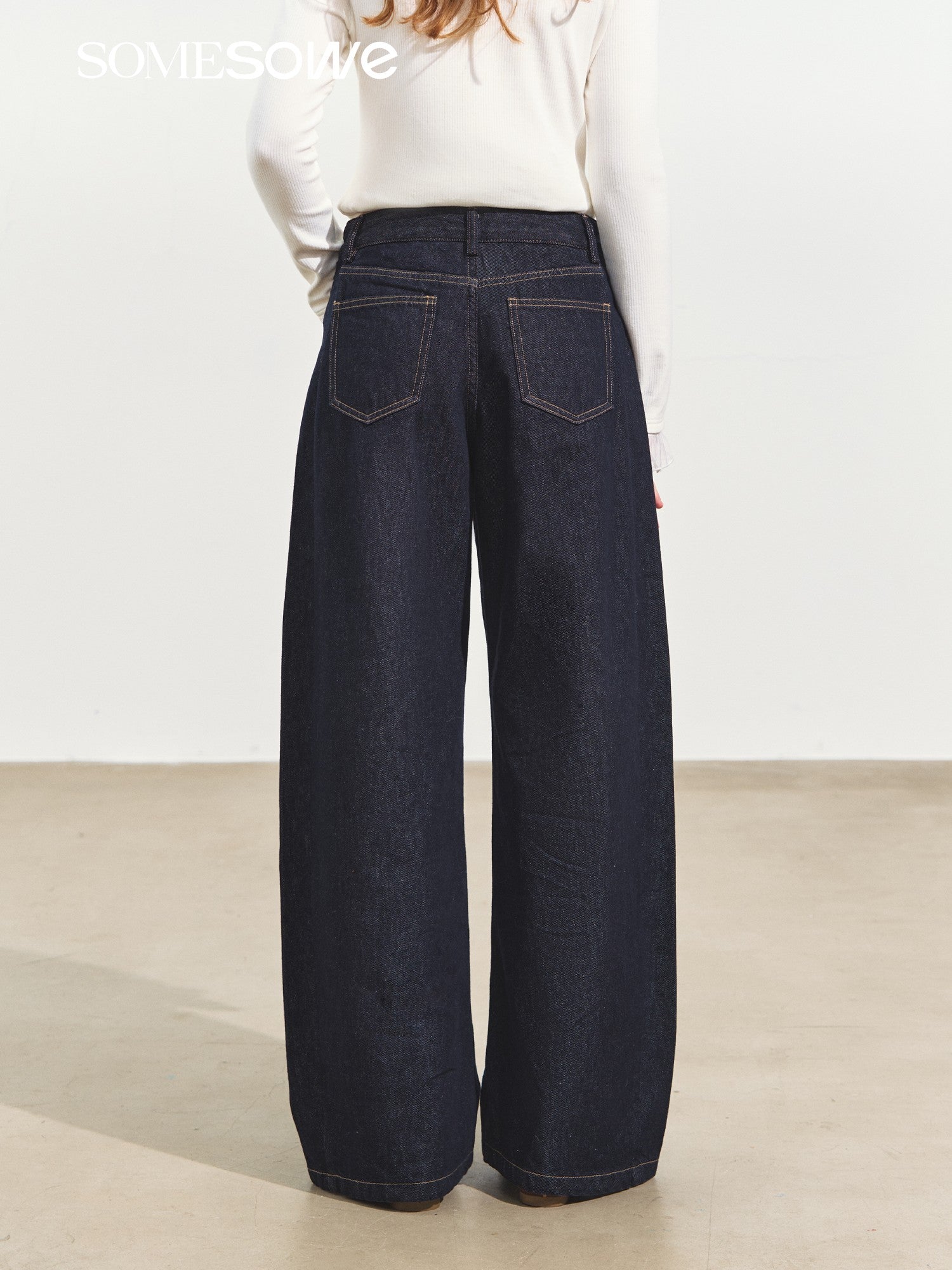 SOMESOWE Raw Denim Pleated Banana Pants In Dark Blue | MADAX