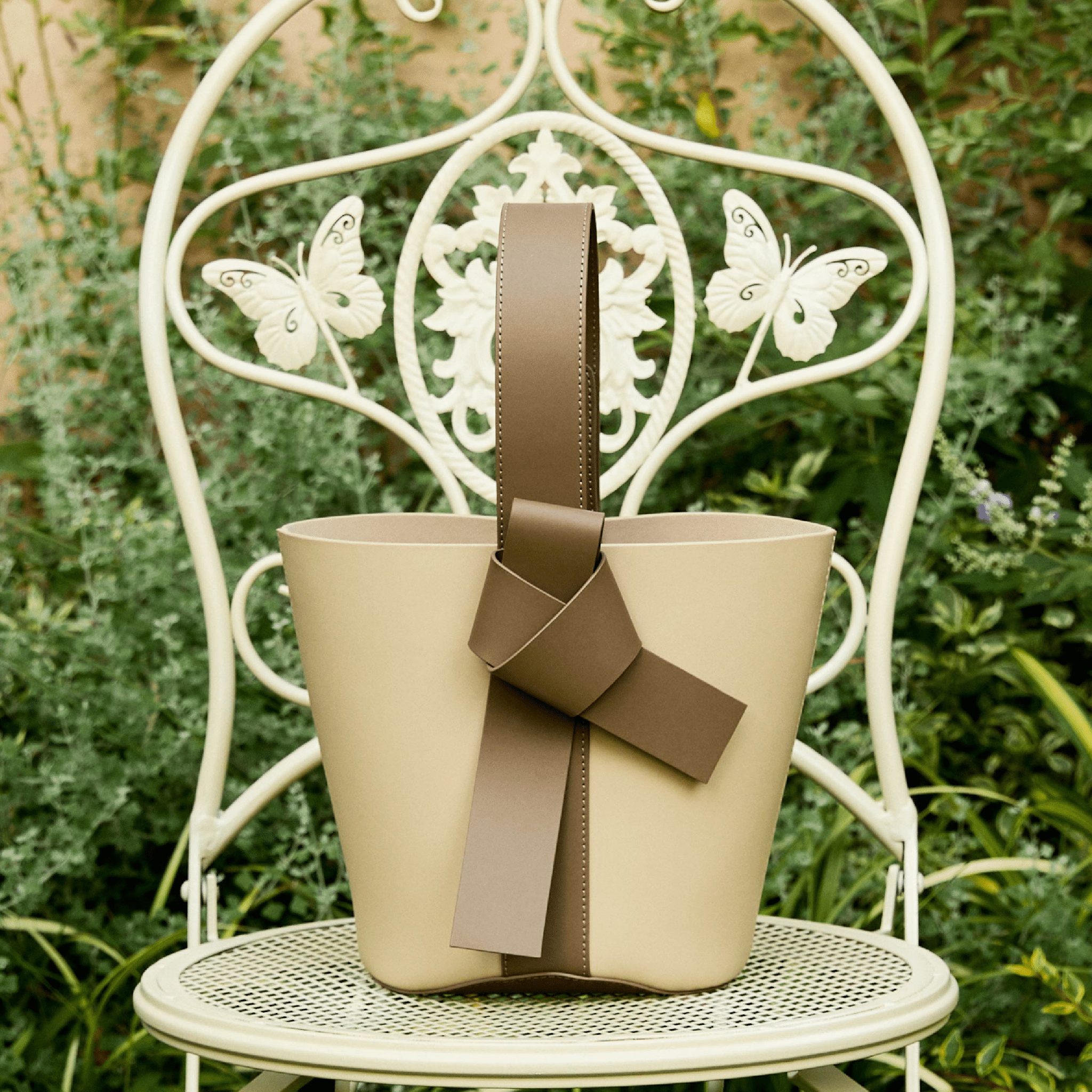 The Yellow Shop Siena Knot Bucket Bag in Cold Tea Apricot | MADAX