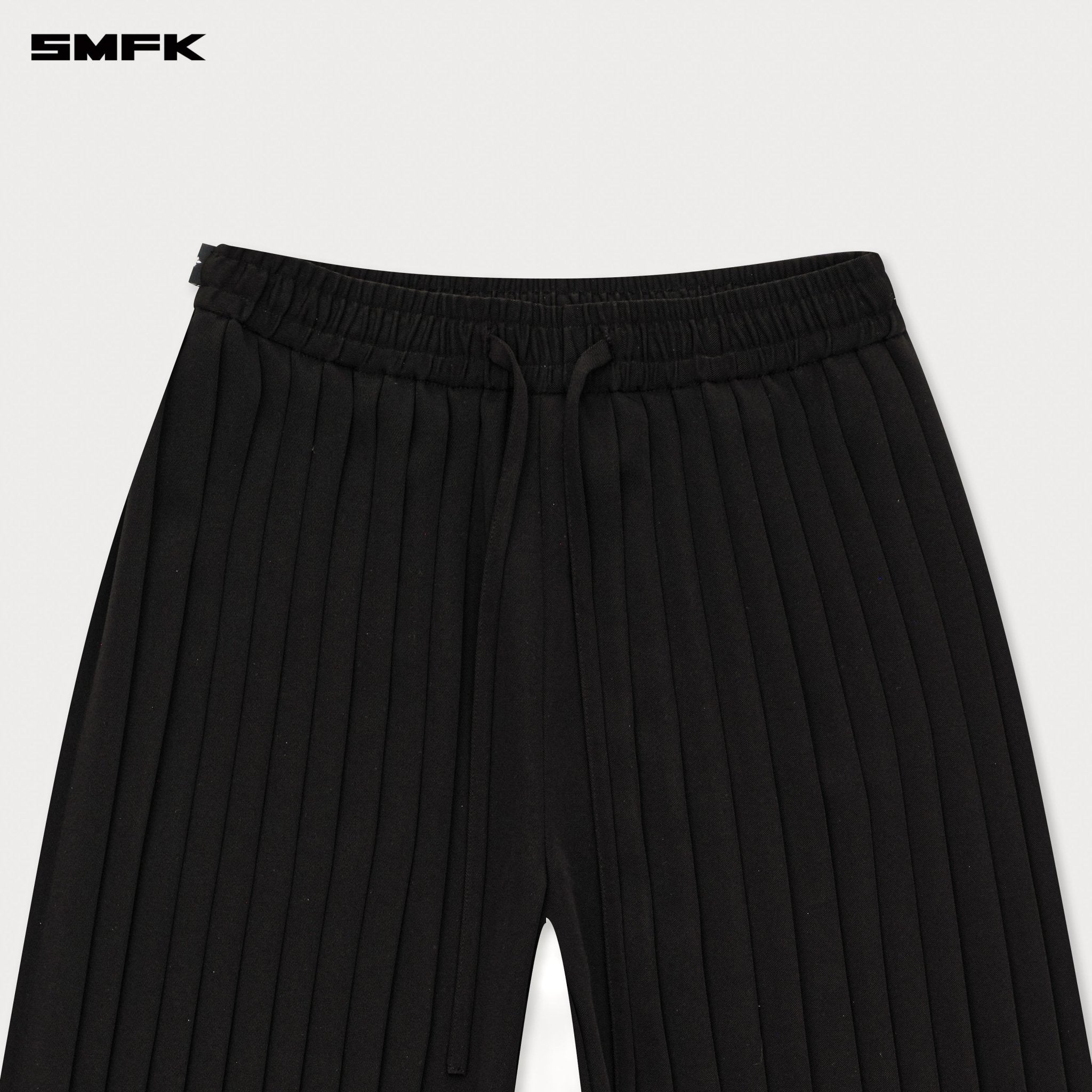 SMFK Wild World Pleated Trousers In Black | MADAX
